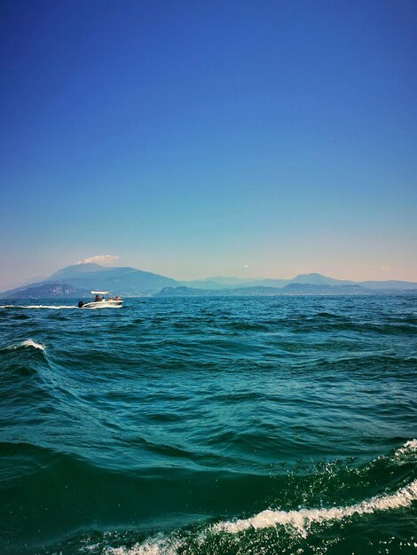 Scenic view of sea against clear blue sky