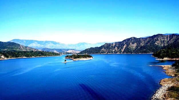 Scenic view of sea against clear blue sky