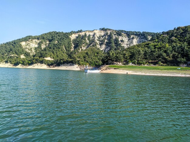 Scenic view of sea against clear blue sky