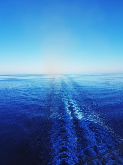 Scenic view of sea against clear blue sky