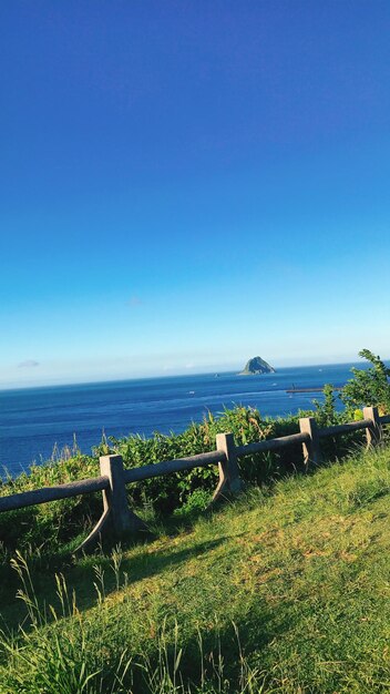 Scenic view of sea against clear blue sky