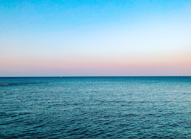 Photo scenic view of sea against clear sky during sunset monopoli