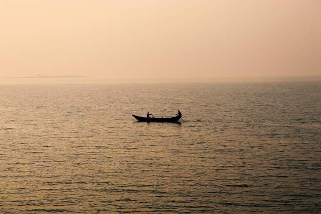 Scenic view of sea against clear sky during sunset