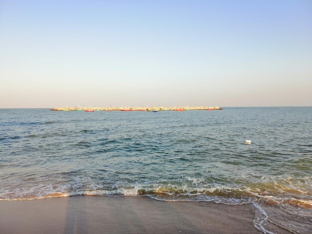 Scenic view of sea against clear sky during sunset