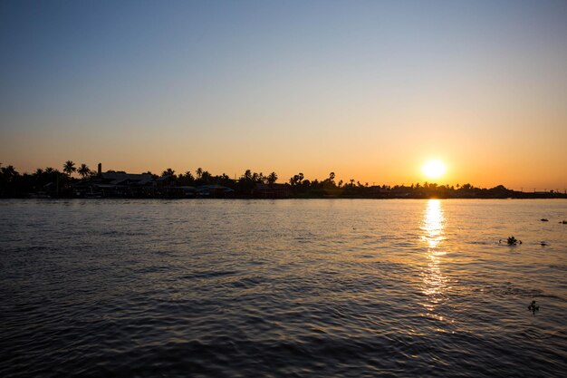 Scenic view of sea against clear sky during sunset