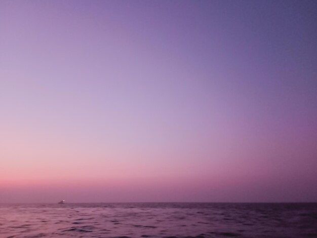 Scenic view of sea against clear sky during sunset