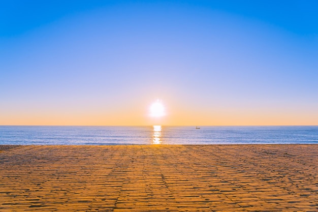 Scenic view of sea against clear sky during sunset