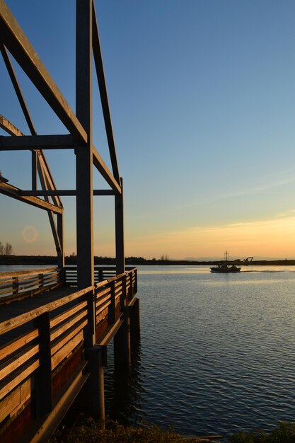 Scenic view of sea against clear sky during sunset