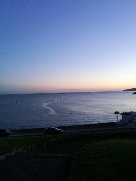 Scenic view of sea against clear sky during sunset