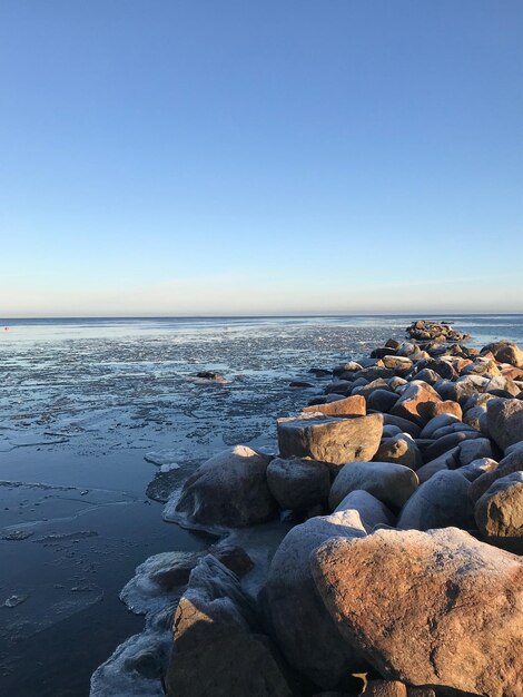 Scenic view of sea against clear sky