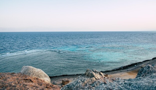 Photo scenic view of sea against clear sky