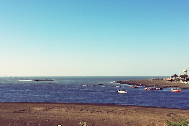 Photo scenic view of sea against clear sky