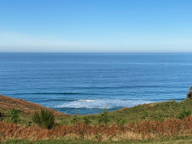 Photo scenic view of sea against clear sky