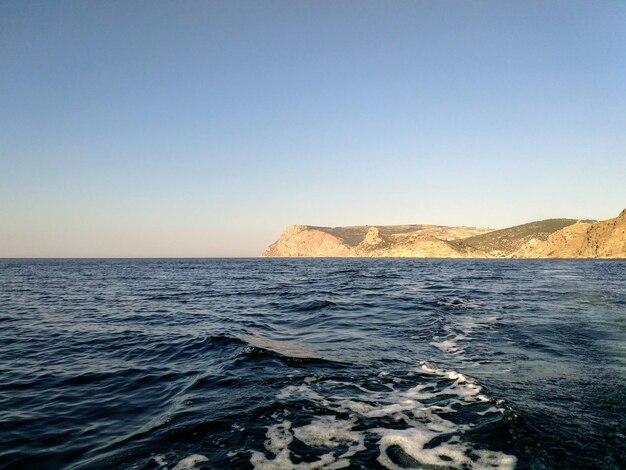 Photo scenic view of sea against clear sky