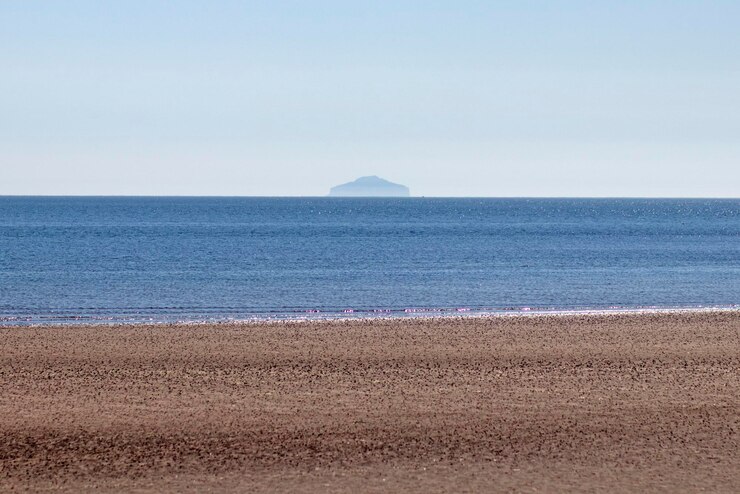 Photo 晴れた空を背景に海の景色