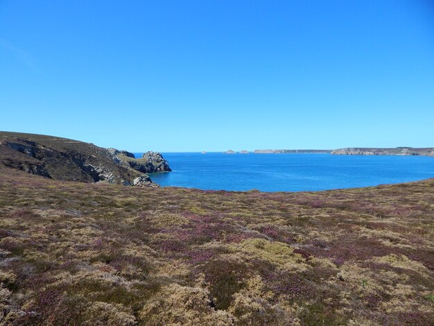 Photo scenic view of sea against clear sky