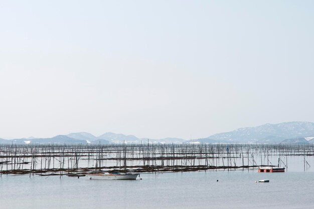 Photo scenic view of sea against clear sky