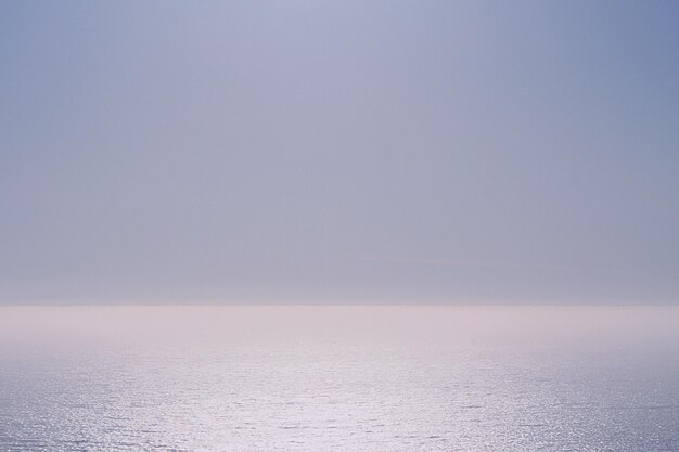 Photo scenic view of sea against clear sky