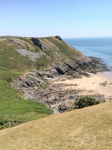 Photo scenic view of sea against clear sky