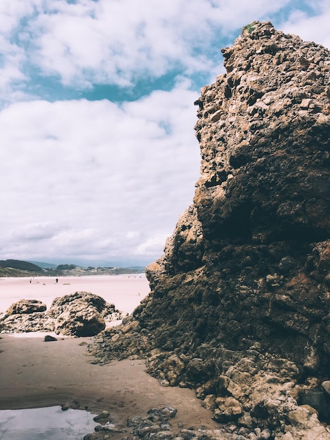 Photo scenic view of sea against cloudy sky