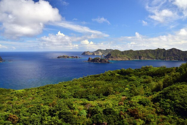 Photo scenic view of sea against cloudy sky