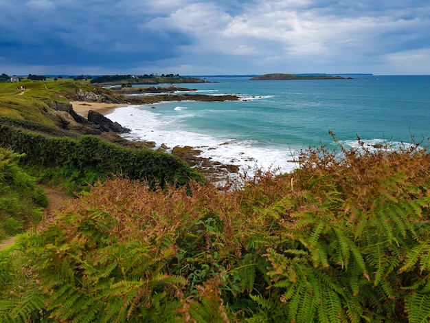 Scenic view of sea against cloudy sky