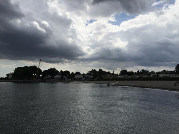 Scenic view of sea against cloudy sky