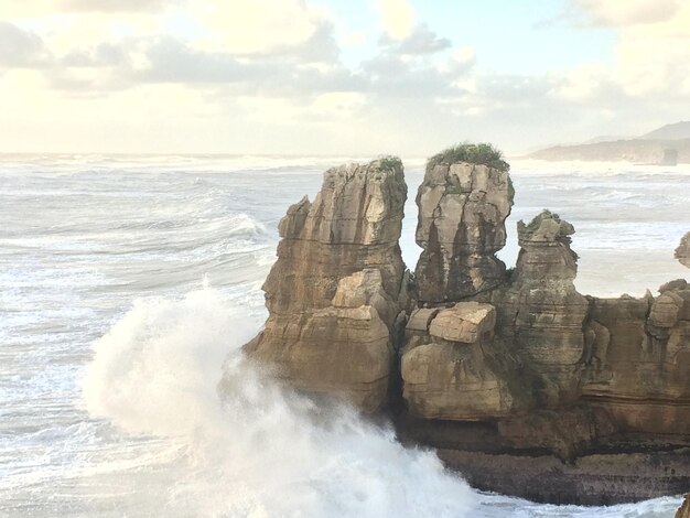 Scenic view of sea against cloudy sky