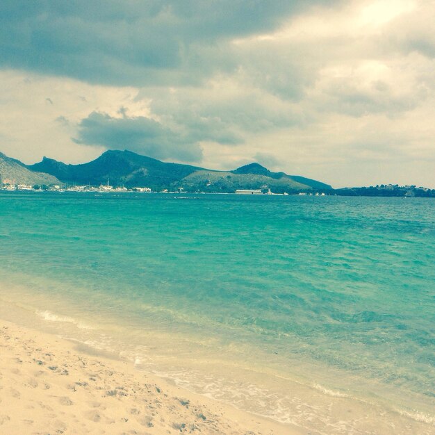 Scenic view of sea against cloudy sky