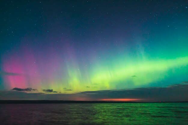 Scenic view of sea against northern lights