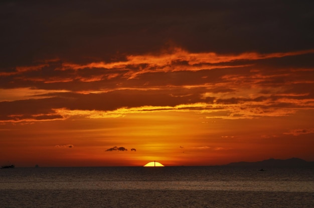 Scenic view of sea against orange sky