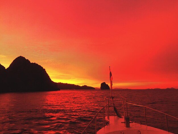 Scenic view of sea against orange sky