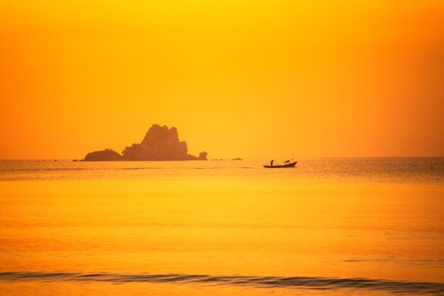 Scenic view of sea against orange sky