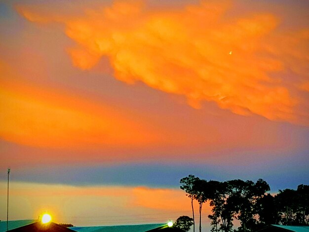 Scenic view of sea against orange sky