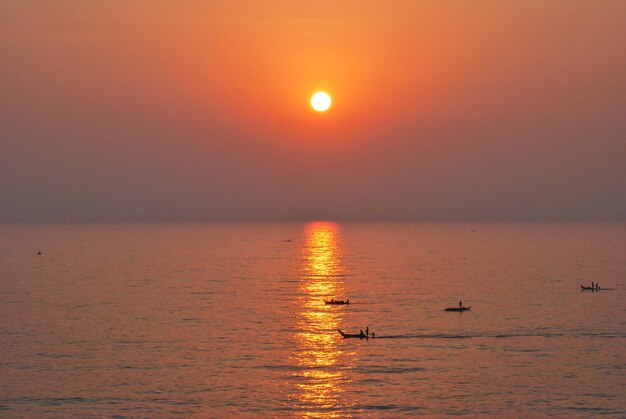 Scenic view of sea against orange sky