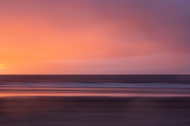 Photo scenic view of sea against orange sky