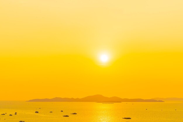 Scenic view of sea against orange sky