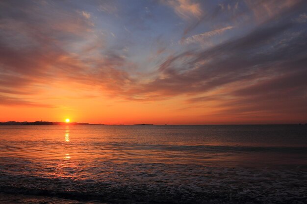 Scenic view of sea against orange sky