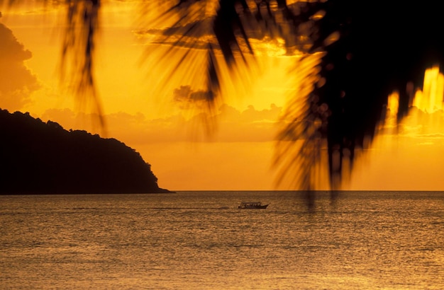 Scenic view of sea against orange sky