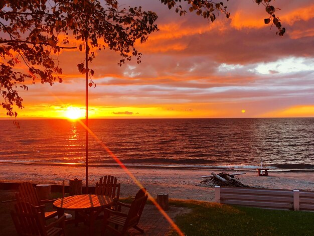 Scenic view of sea against orange sky