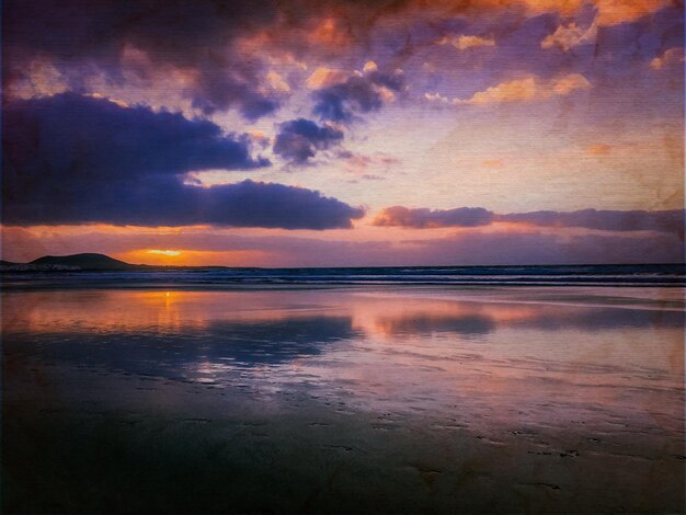 Scenic view of sea against romantic sky at sunset