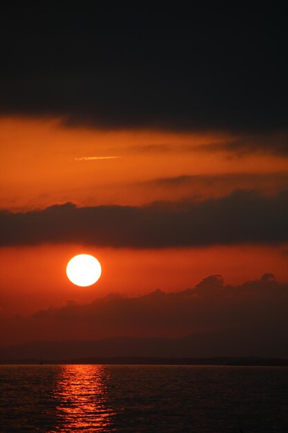 Scenic view of sea against romantic sky at sunset