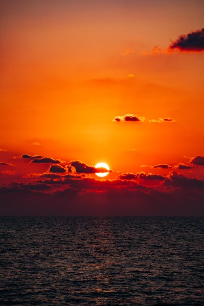 Scenic view of sea against romantic sky at sunset