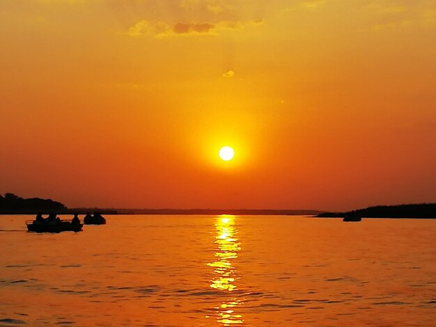 Scenic view of sea against romantic sky at sunset