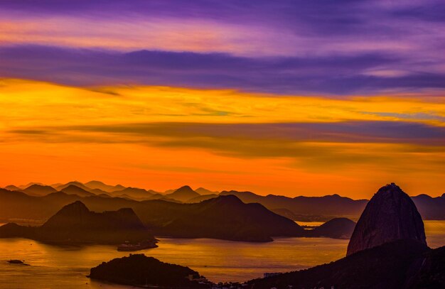 Scenic view of sea against romantic sky at sunset