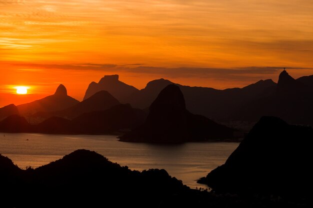 Scenic view of sea against romantic sky at sunset