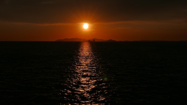 Scenic view of sea against romantic sky at sunset