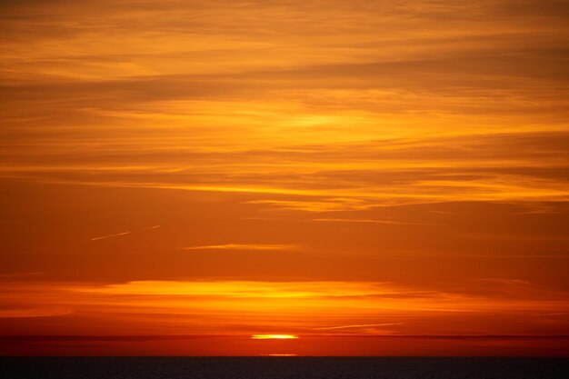 Scenic view of sea against romantic sky at sunset