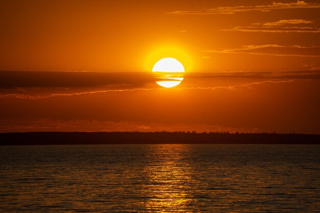 Scenic view of sea against romantic sky at sunset