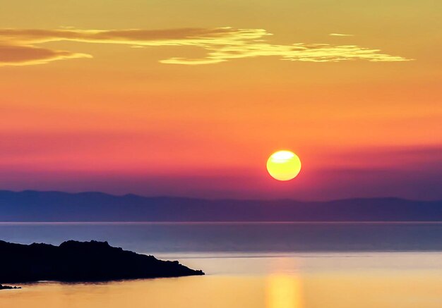 Scenic view of sea against romantic sky at sunset